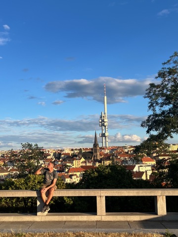 Backpackers watching the view from Vítkov Hill in Prague