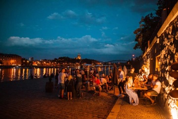 Backpackers going out in Prague at night