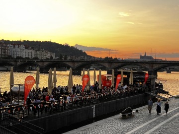 Sunset beer on a boat at Naplavka in Prague